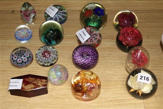 A collection of eleven paperweights, millefiori and floral specimens and four others
